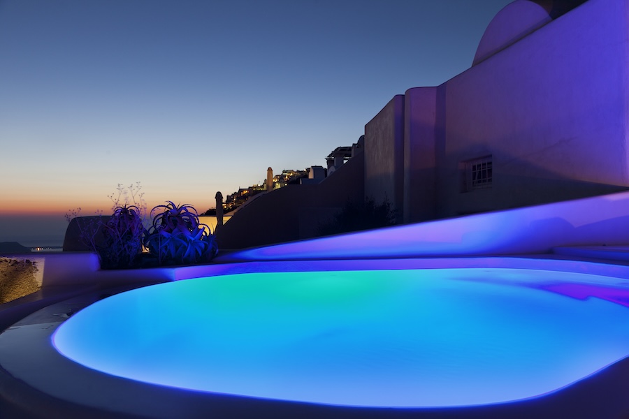 Pool at dusk with colorful underwater llights