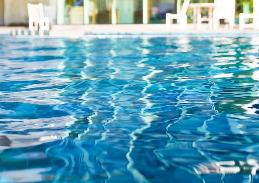 A closeup image of sparkling blue pool water