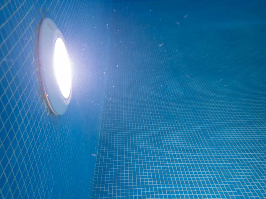 Side, underwater view of a pool light