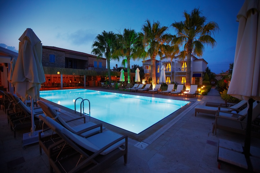 Night view of relaxing pool with lighting in small hotel