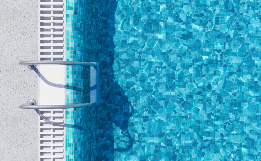 top view of a swimming pool with metal ladders