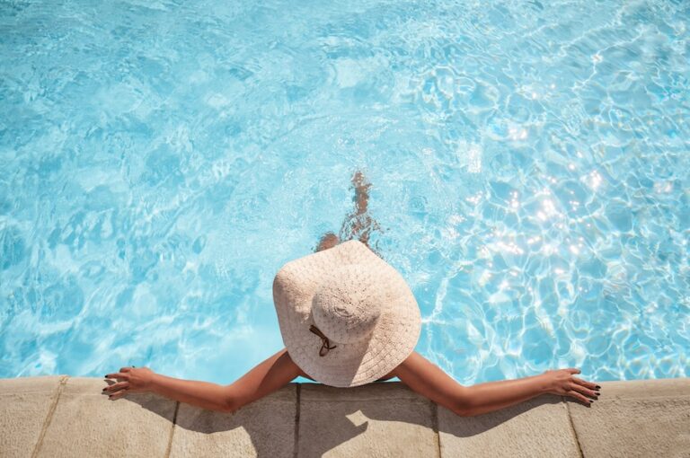 Young woman relaxing in the swimming pool