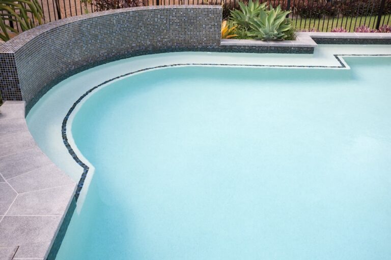 Round shape water pool with bend corner close up over the waterside