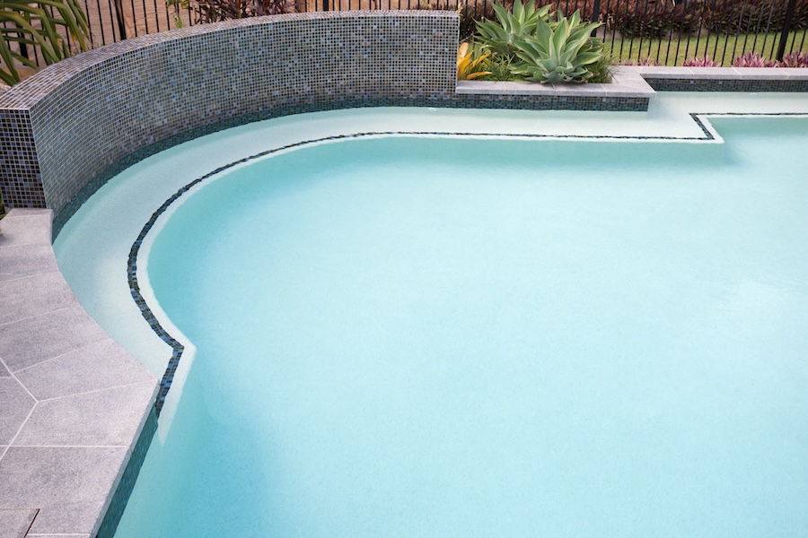 Round shape water pool with bend corner close up over the waterside