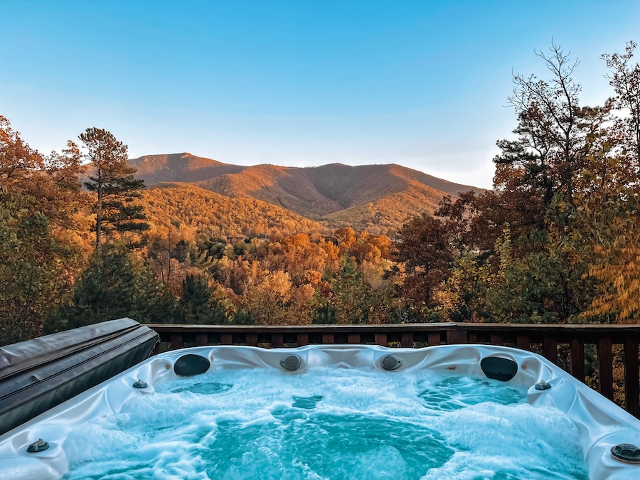 Hot tub with a mountain view.
