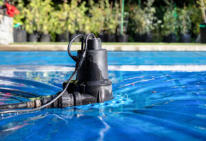 Pool pump in blue swimming pool water